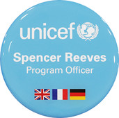 A circle badge light blue backgrounded with UNICEF logo